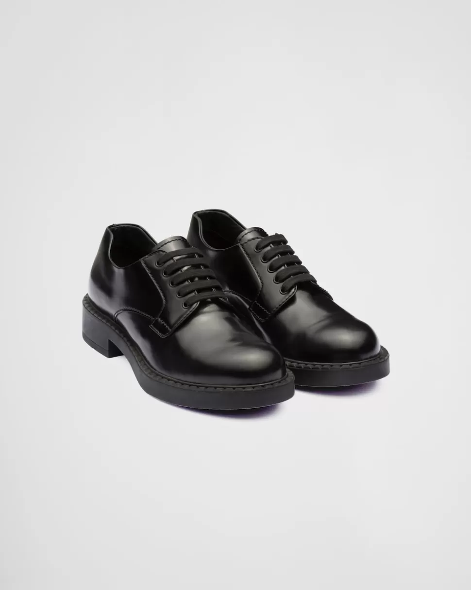 Shop Prada Derby-schuhe Aus Gebürstetem Leder Schwarz